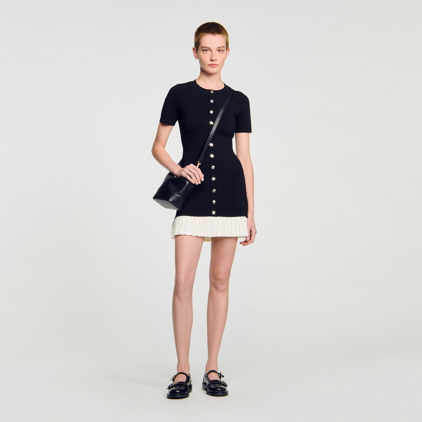 Sandro Mini knit dress with ruffle Black / Ecru