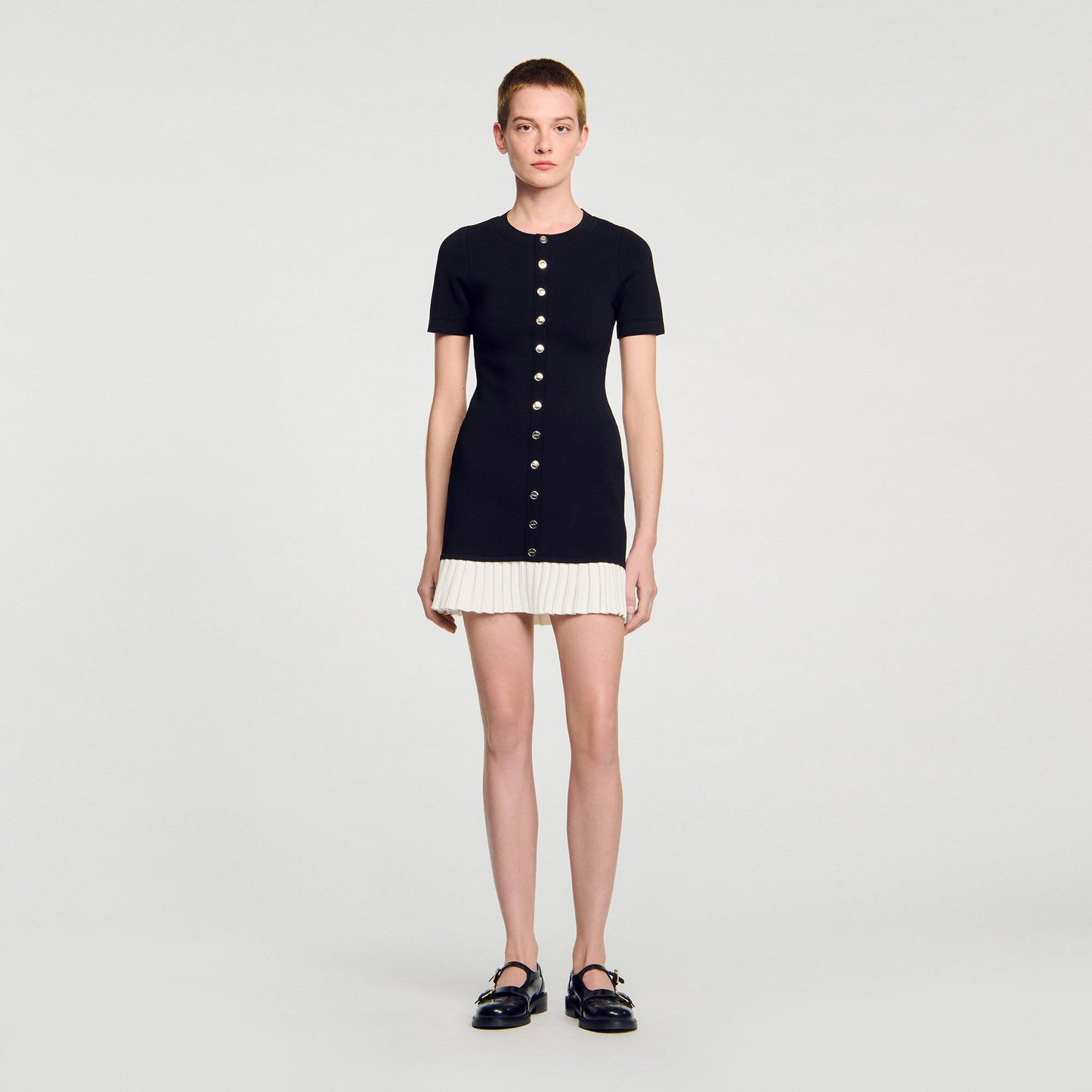 Sandro Mini knit dress with ruffle Black / Ecru