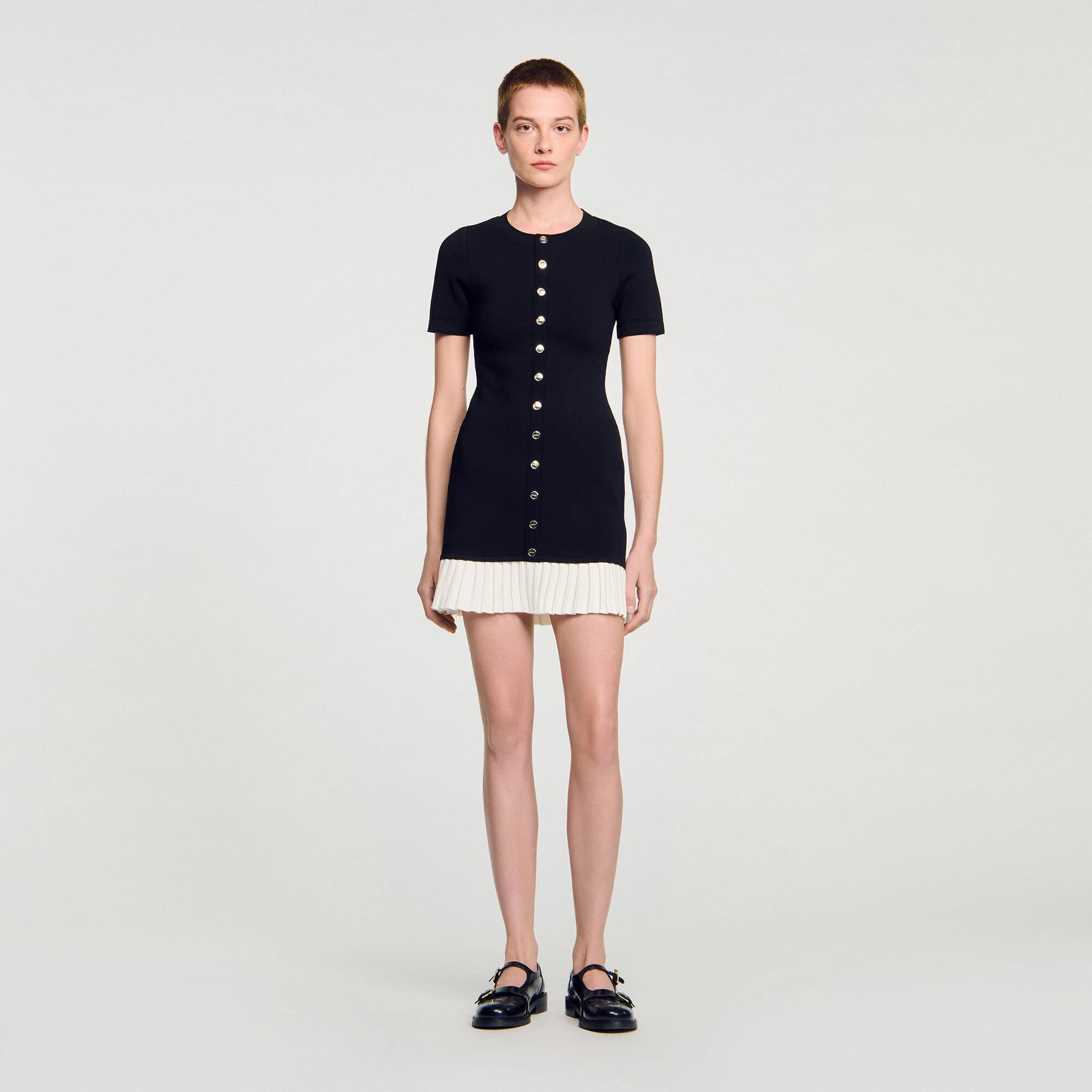 Sandro Mini knit dress with ruffle Black / Ecru