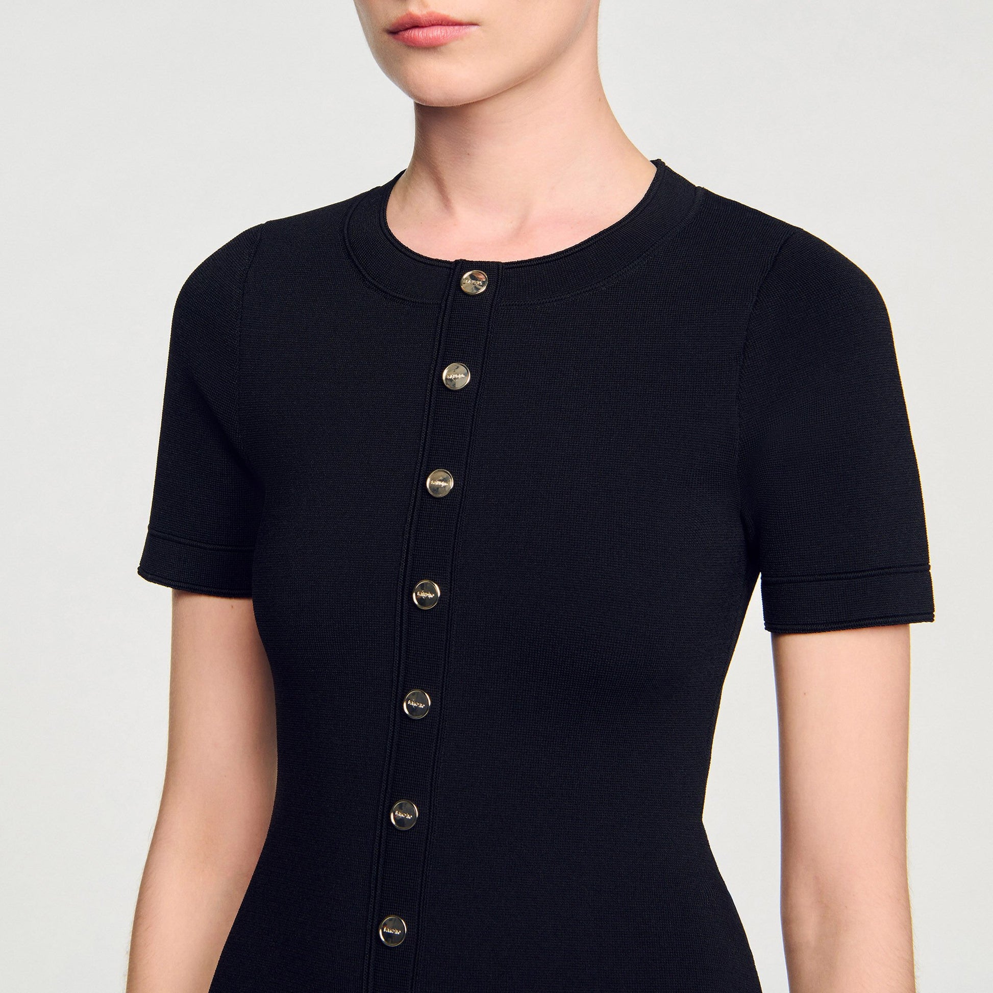 Sandro Mini knit dress with ruffle Black / Ecru