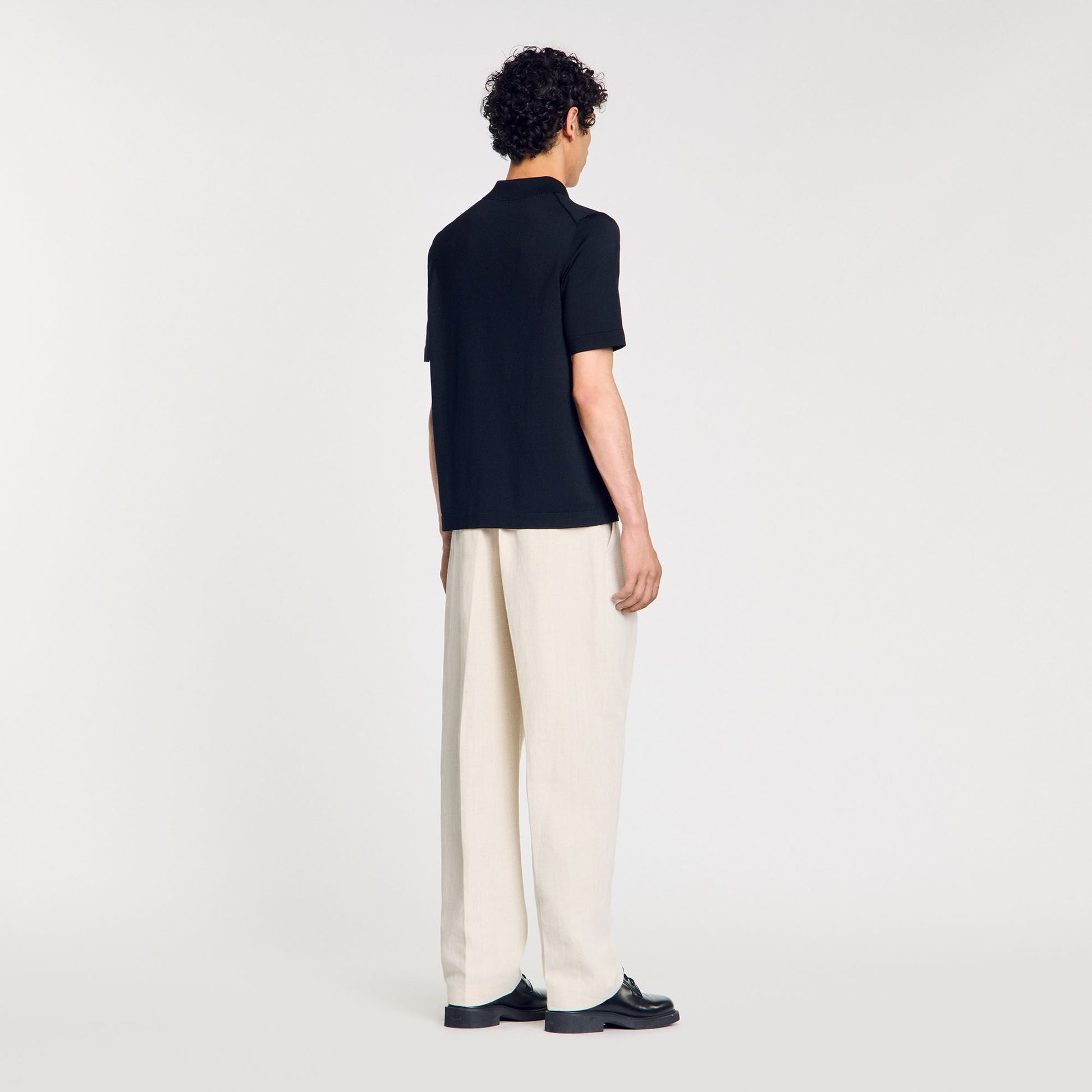 Sandro Knitted polo shirt with zip collar Fonte